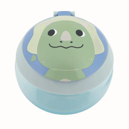 A round plastic ltoddler snack box with a light blue base and lid, featuring a cartoon dinosaur face printed on top in green, beige, and blue.