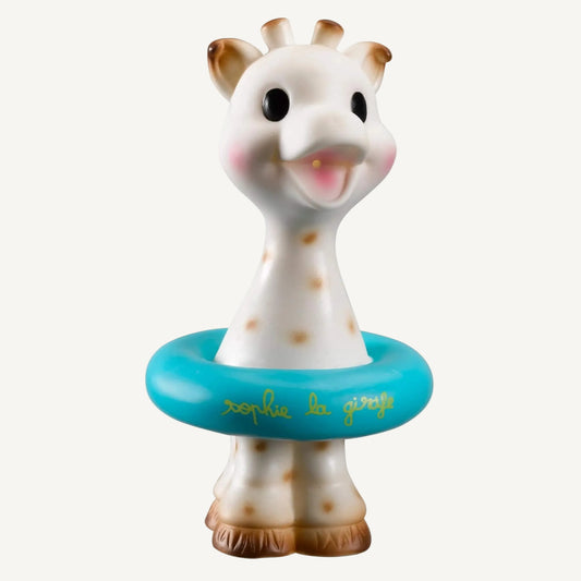 A giraffe-shaped bath toy shown upright with a blue floating ring around the body and spotted detailing.