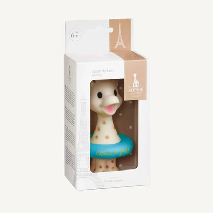 A boxed giraffe bath toy shown from a front angle with beige branding details and visible floating ring.