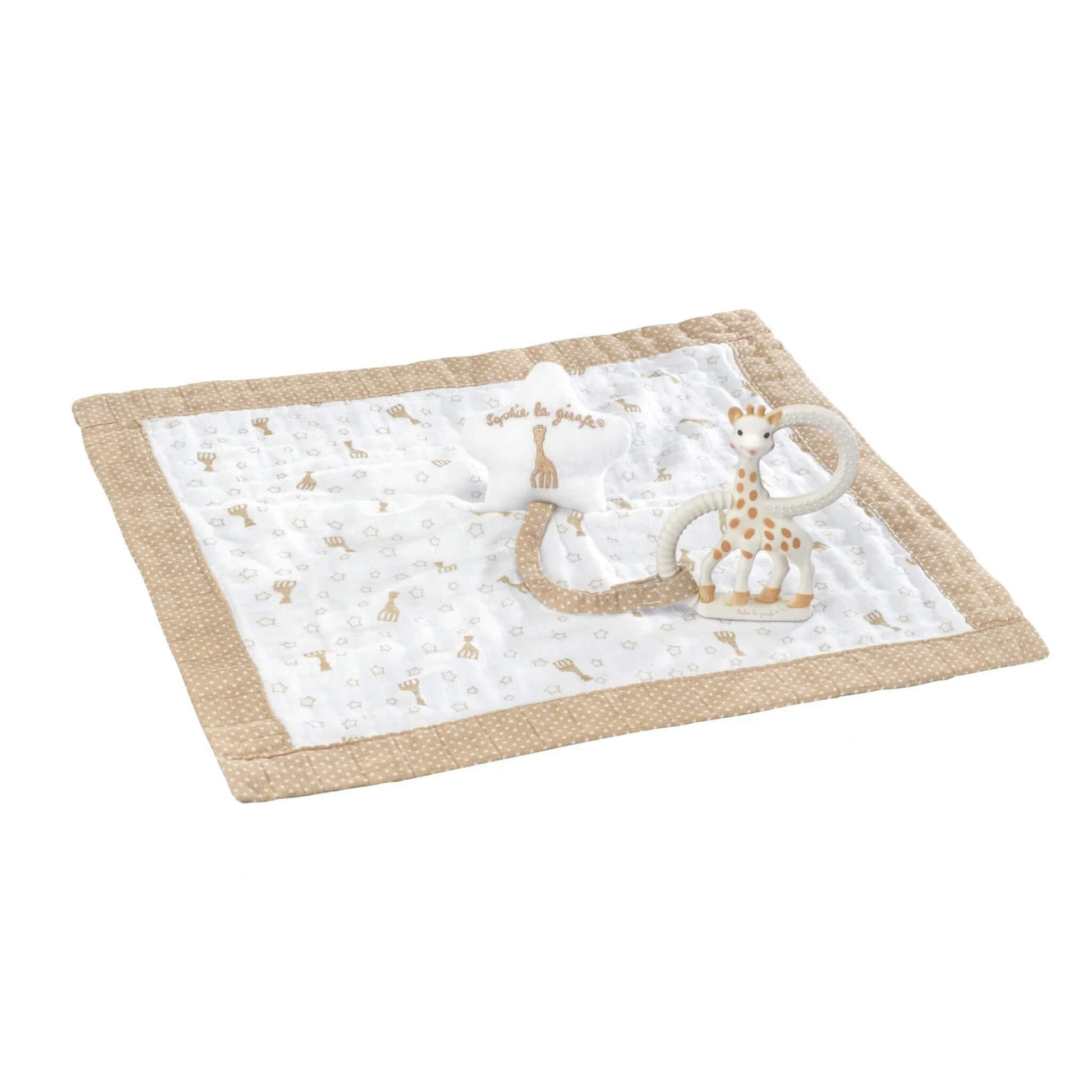 A white organic cotton baby comforter with beige polka dot trim and small giraffe print, laid flat with a natural rubber giraffe teething ring attached by a fabric loop.