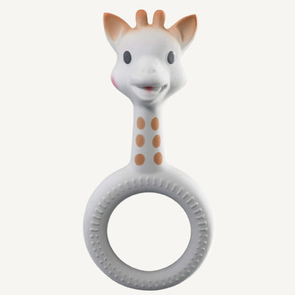 A white natural rubber giraffe-shaped ring teether with raised dot textures around a circular grip and a smooth giraffe head.