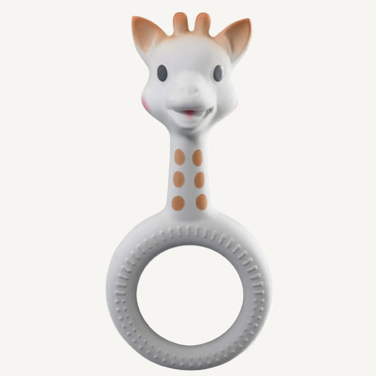 A white natural rubber giraffe-shaped ring teether with raised dot textures around a circular grip and a smooth giraffe head.