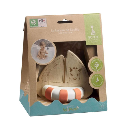 Sophie La Girafe So’Pure Rubberwood Boat bath toy with wooden sail and removable natural rubber float, presented in recyclable gift packaging.