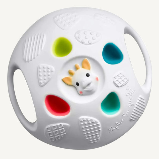 Textured white sensory ball with raised grip panels, colourful soft-touch sections, and small giraffe face detail at the centre.