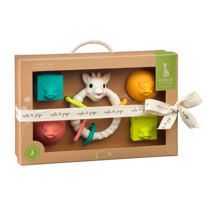Sophie La Girafe So Pure Early Learning Gift Set presented in a kraft gift box with a giraffe ring teether, textured balls, and sensory cubes.