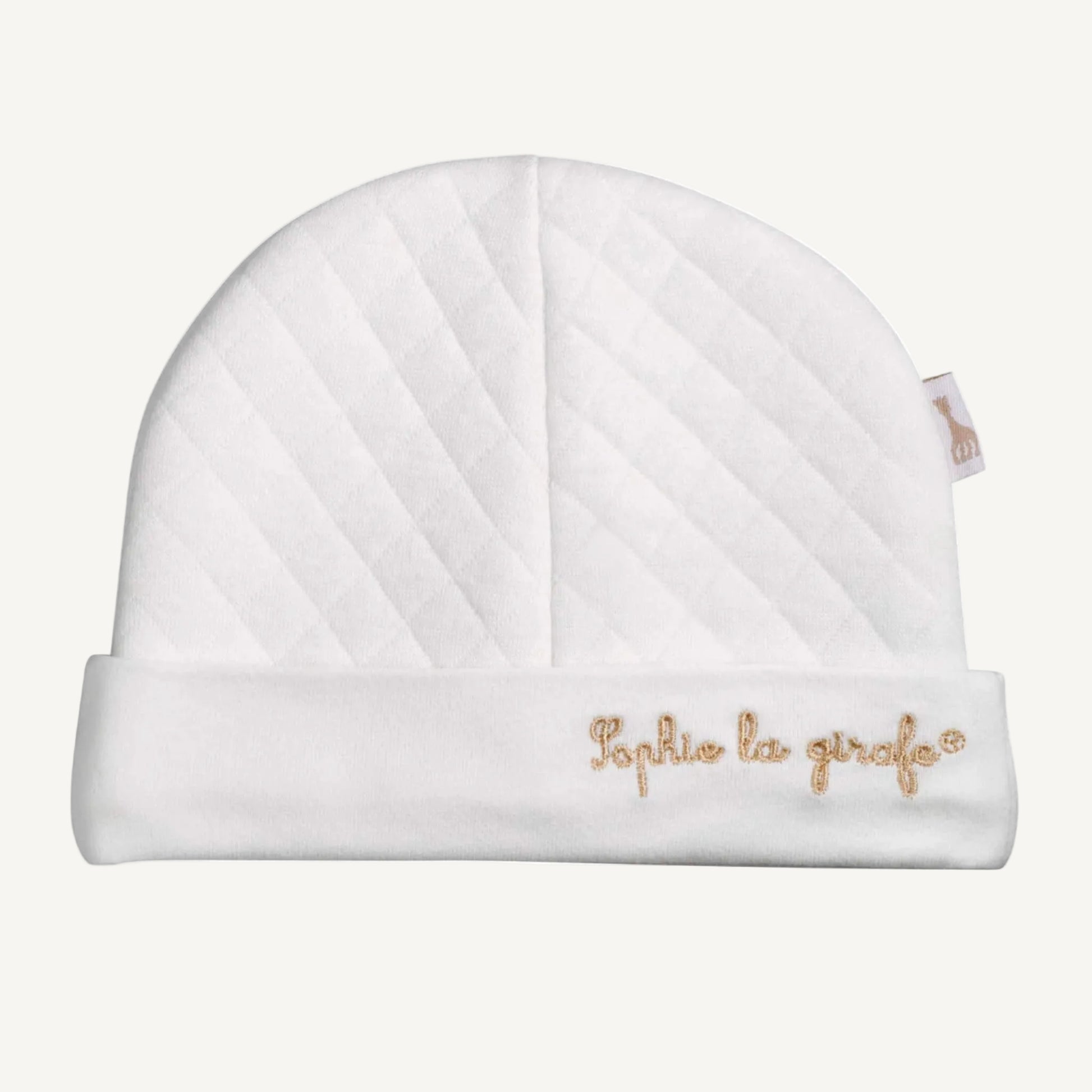 A white quilted newborn hat with a folded brim and embroidered Sophie la girafe text on the front.