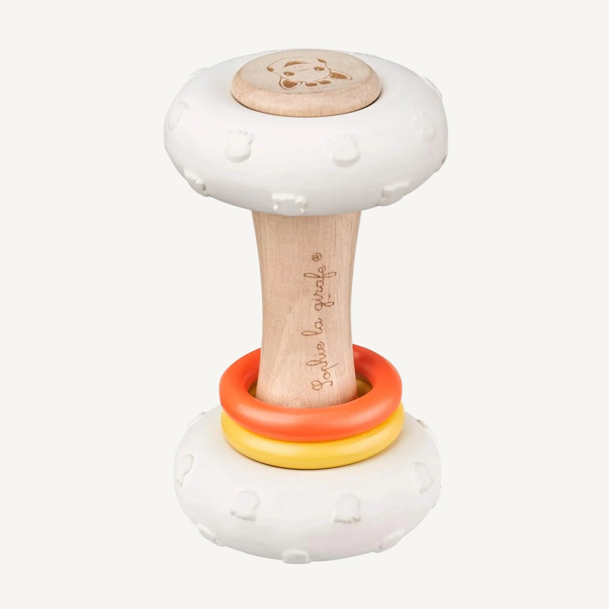 A wooden baby rattle with two white natural rubber discs, a smooth wooden handle, and yellow and orange sliding rings.