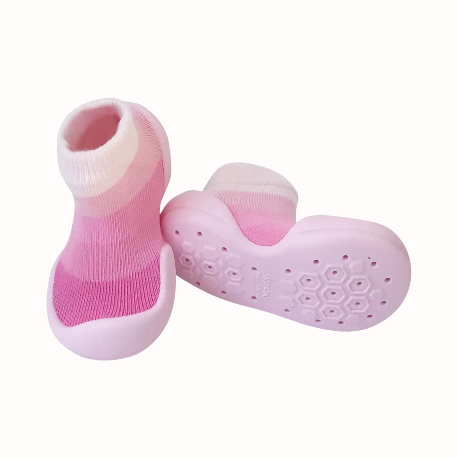 Pair of pink Step Ons with striped knit uppers, pale pink soles and a textured non-slip grip pattern underneath.