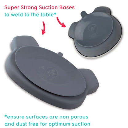 Silicone baby feeding set in grey, featuring super strong suction base on a bear-shaped bowl for secure placement on tables.