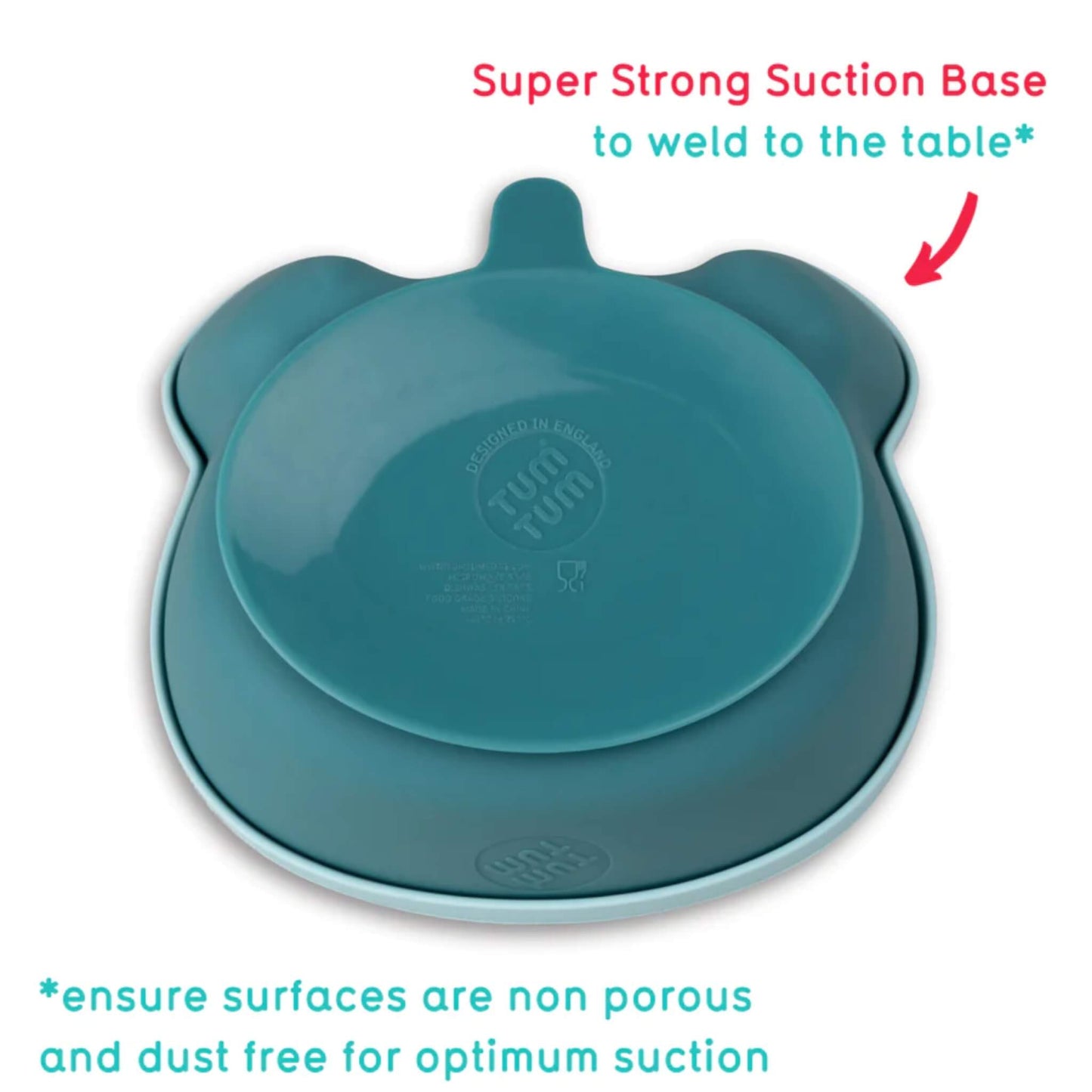 Underside view of blue silicone baby bowl showing wide suction base designed to grip smooth table surfaces.