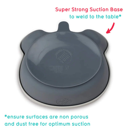 The underside of a silicone baby bowl showing a wide suction base designed to grip smooth, non-porous surfaces.
