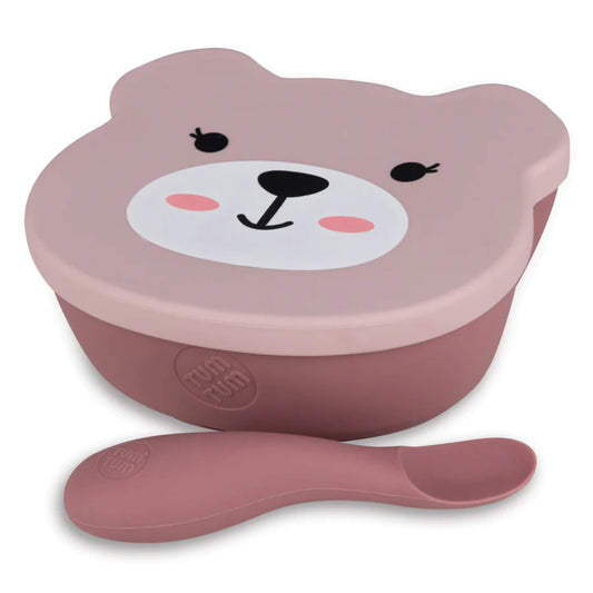 TUM TUM Baby Suction Bowl & Spoon Set in pink, showing a bear-shaped silicone bowl with fitted lid and a matching chunky handled spoon.