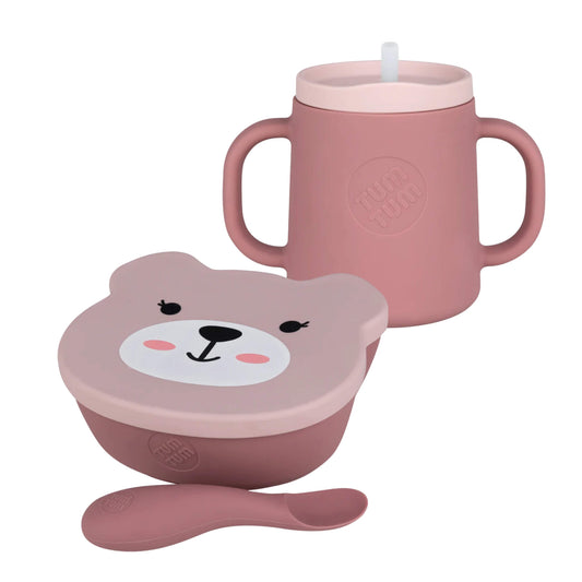 Pink TUM TUM silicone suction bowl, matching spoon and three-way trainer cup with straw lid, shown together as an everyday feeding set.