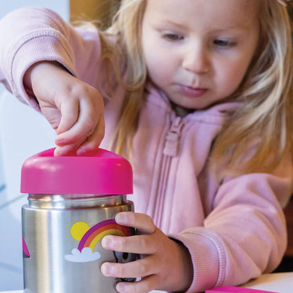 A young girl in a pink zip-up hoodie holds a stainless steel water bottle with a bright pink lid and a rainbow graphic. She is shown in a close-up, focusing on the bottle.
