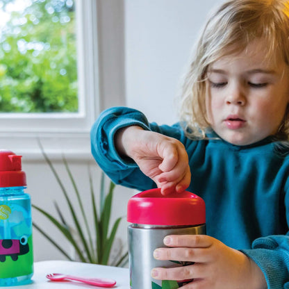 Child opening an insulated food flask with red lid, perfect for keeping food hot or cold, with easy-to-use design for little hands.