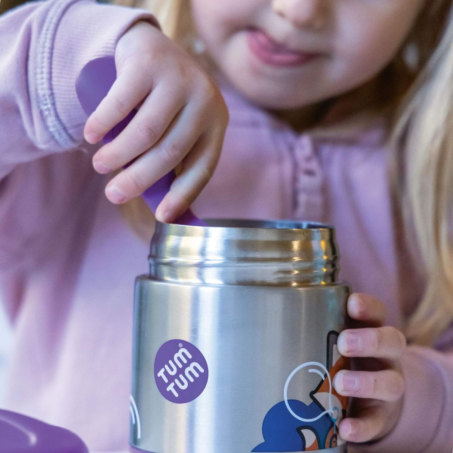 Child using a Felicity Fox insulated food flask, eating from the flask with a purple spork, perfect for hot or cold meals.