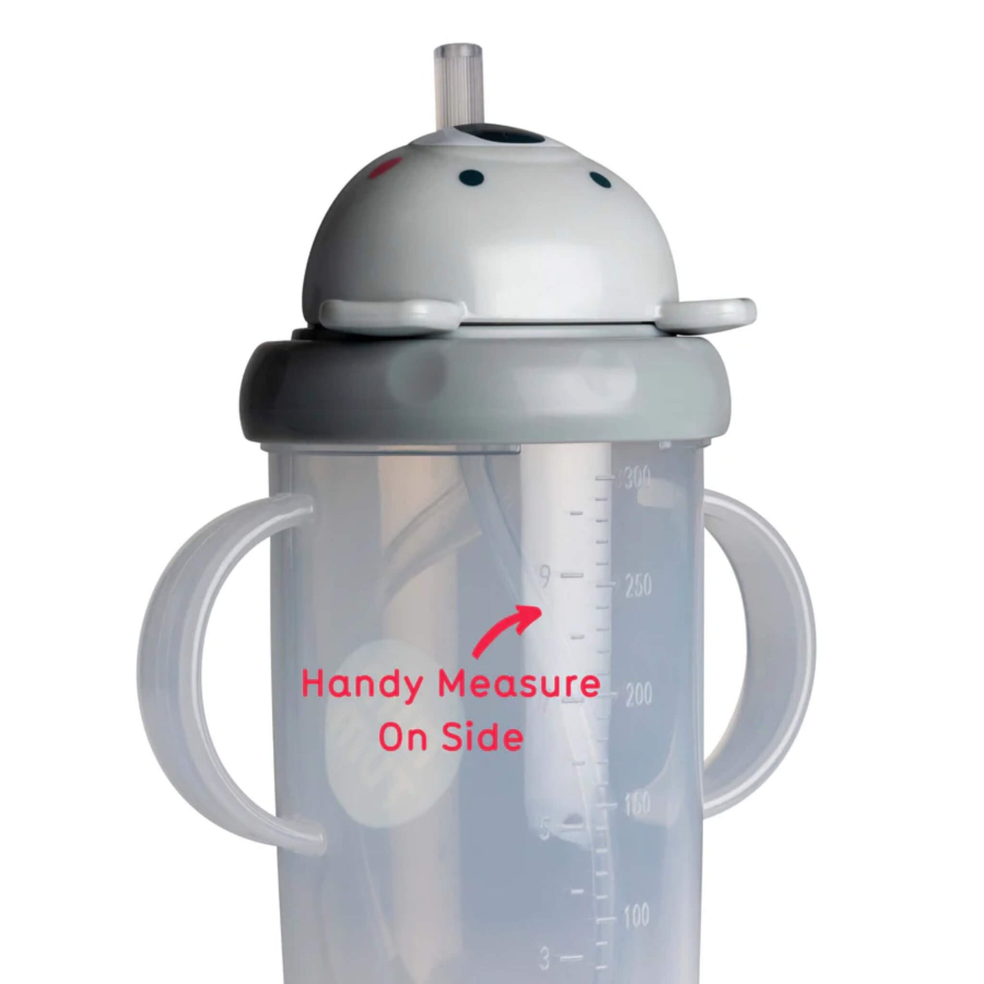 Side view of a sippy cup showing printed volume measurement markings on the cup wall, with the internal straw visible behind the markings