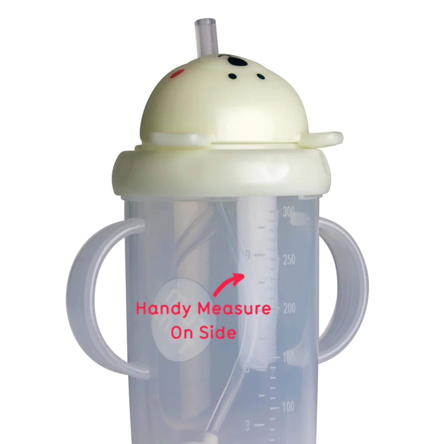 Glow-in-the-dark sippy cup tipped sideways showing the weighted straw resting at the lowest point inside the cup.