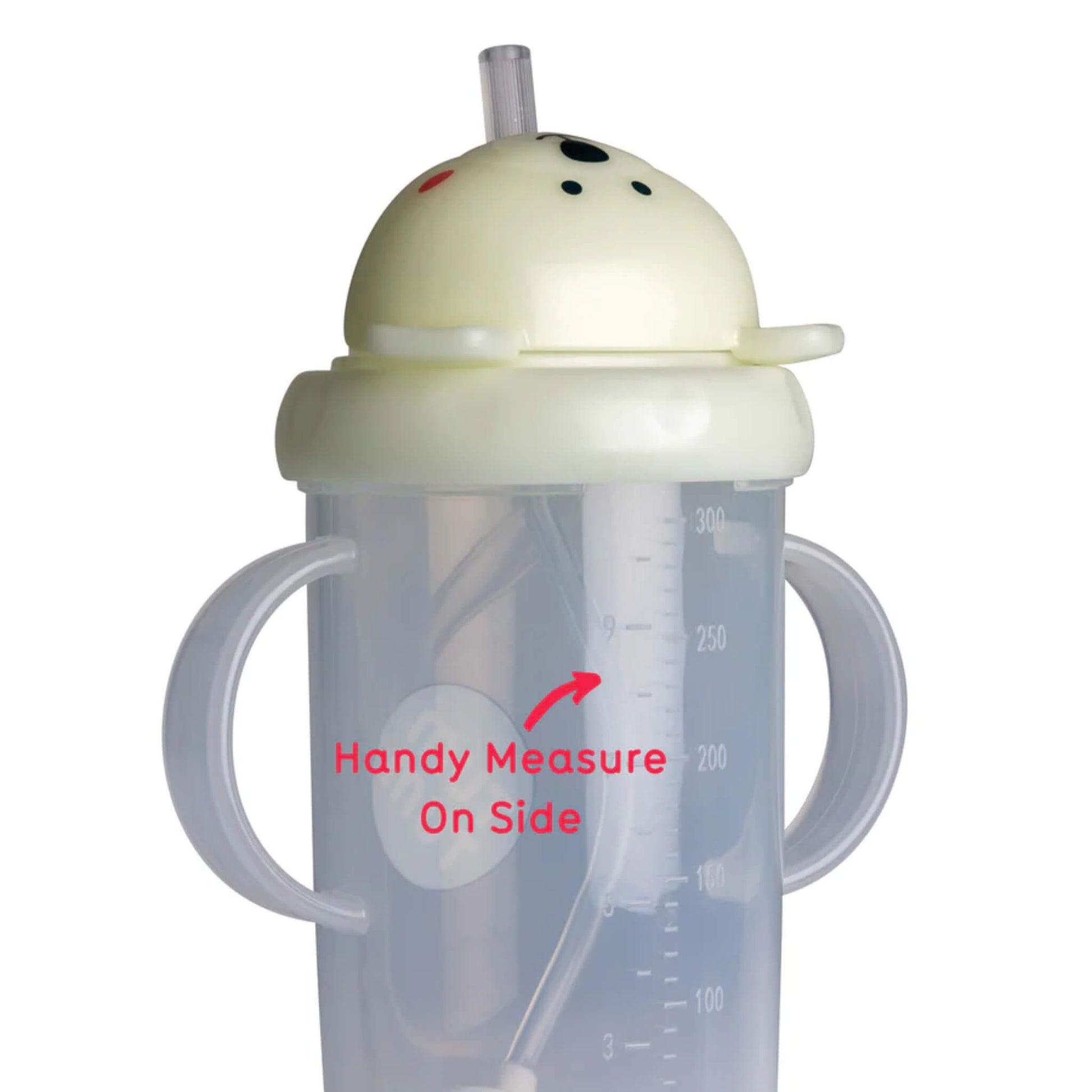 Glow-in-the-dark sippy cup tipped sideways showing the weighted straw resting at the lowest point inside the cup.