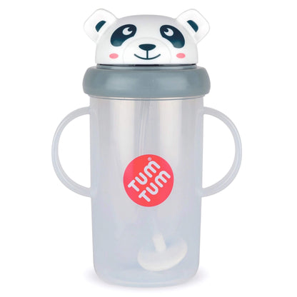 A translucent baby cup with two handles, a gray lid, and a white panda-shaped lid topper. A red circular sticker on the front reads 'TUM TUM'.