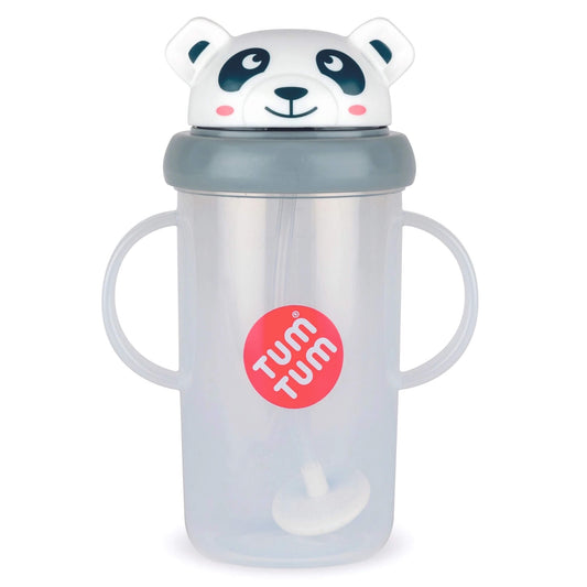 A translucent baby cup with two handles, a gray lid, and a white panda-shaped lid topper. A red circular sticker on the front reads 'TUM TUM'.