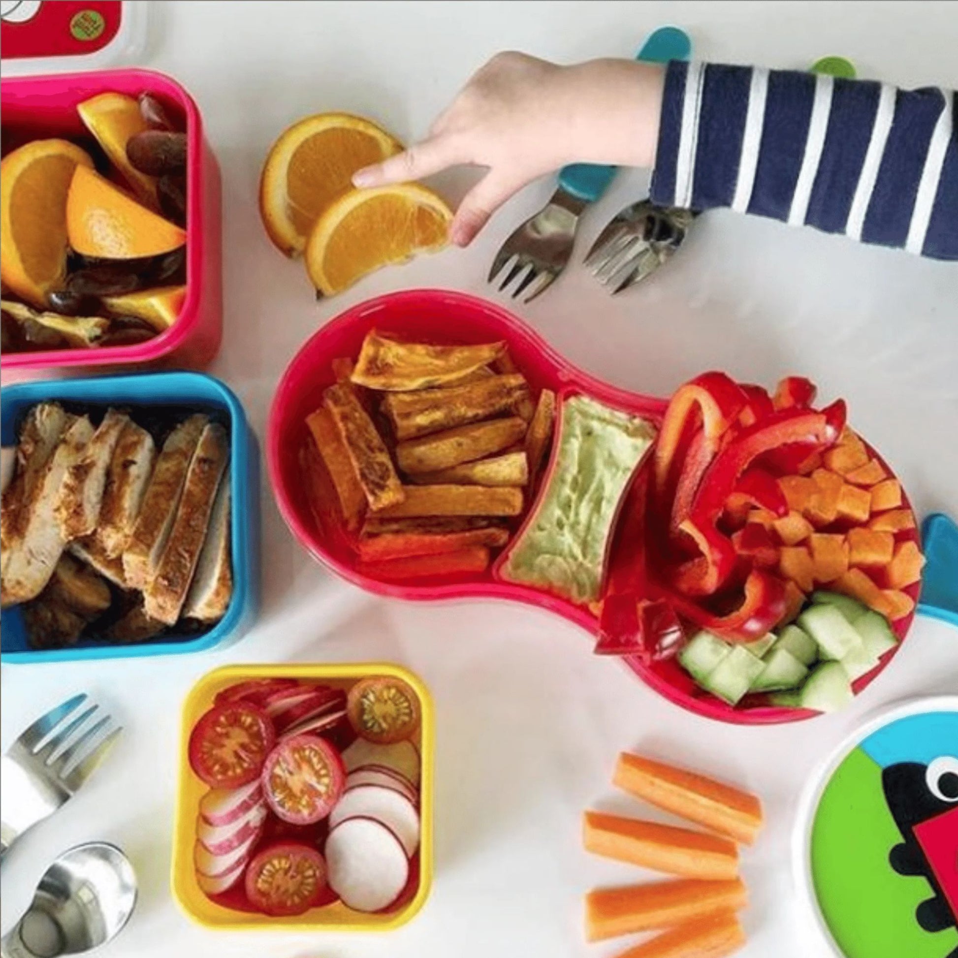 A filled kid's Lunch Box with Dipping Pot Separator, featuring healthy snacks like veggies, chicken, and dip, ideal for kids' balanced meals.