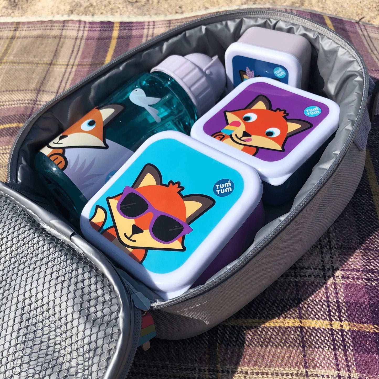 Kids nesting snack pots and water bottle , with a fox character design, packed inside a lunch bag, perfect for children's snacks and meals on the go.