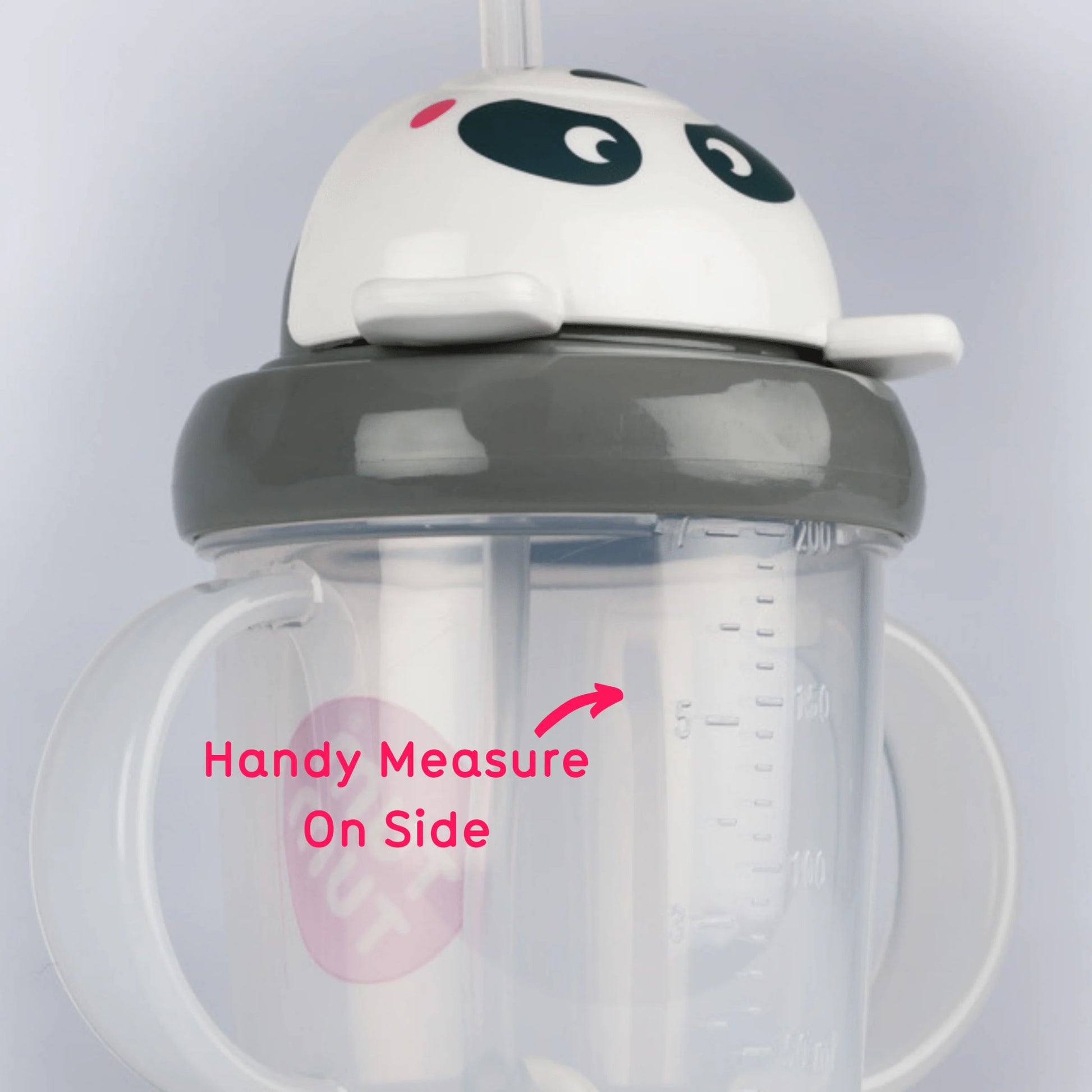 Side view of white panda character cup highlighting raised volume markings on clear cup body, with pink arrow and text reading “Handy Measure On Side”.