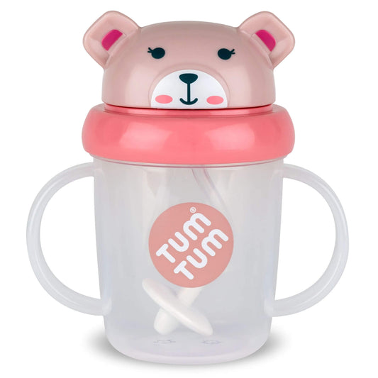 TUM TUM Tippy Up Cup (Betsy Bear) with twin handles, a clear cup body and a pink bear-shaped flip-top lid with a weighted straw visible inside.
