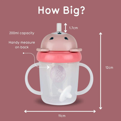 A baby sippy cup with handles and a cute animal-face lid, shown on a dusty rose background with measurement labels and arrows indicating 12 cm height, 11 cm width, 1.7 cm straw tip, 200 ml capacity, and a handy measure on the back.