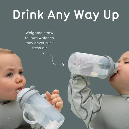 Two babies drinking from sippy cups with text explaining the weighted straw feature.