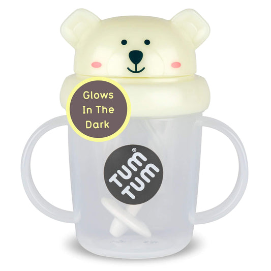 Tum Tum Tippy Up Cup (Pete Polar Bear), clear toddler straw cup with cream glow-in-the-dark polar bear lid, side handles and weighted straw visible inside.