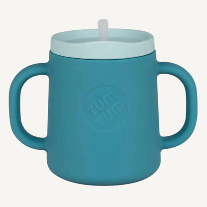 A blue silicone trainer cup with two handles and a straw lid, shown from the front to highlight the cup shape and grip.