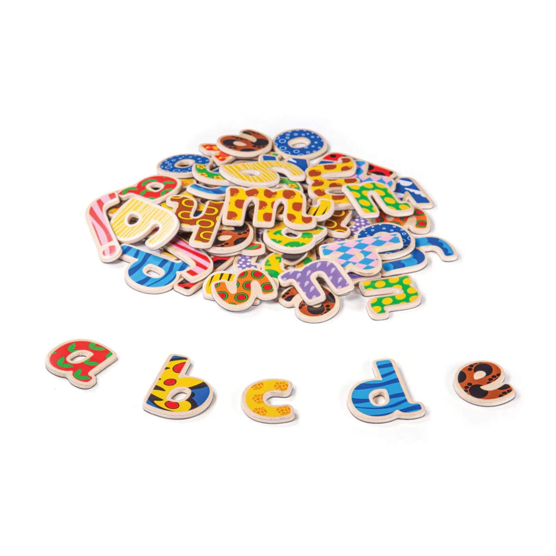 Colourful wooden alphabet letters scattered on a white background.