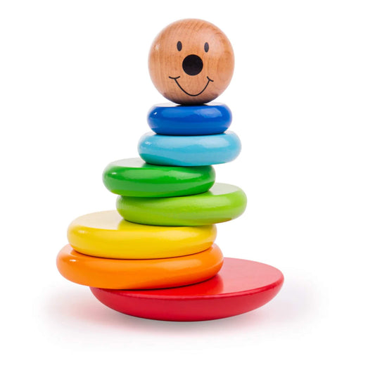 Tidlo Magnetic Wobbly Stacker featuring a smiling wooden face and colourful rainbow discs stacked on a red rocking base.