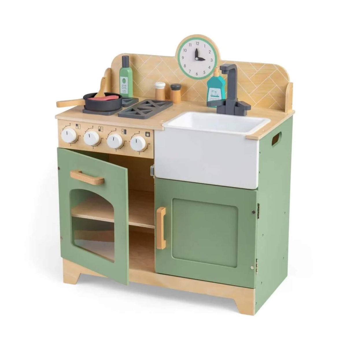 A wooden toy kitchen playset with sage green cabinets, a light wood frame, a white farmhouse sink, toy stove, bottles, and a round clock on a white background.