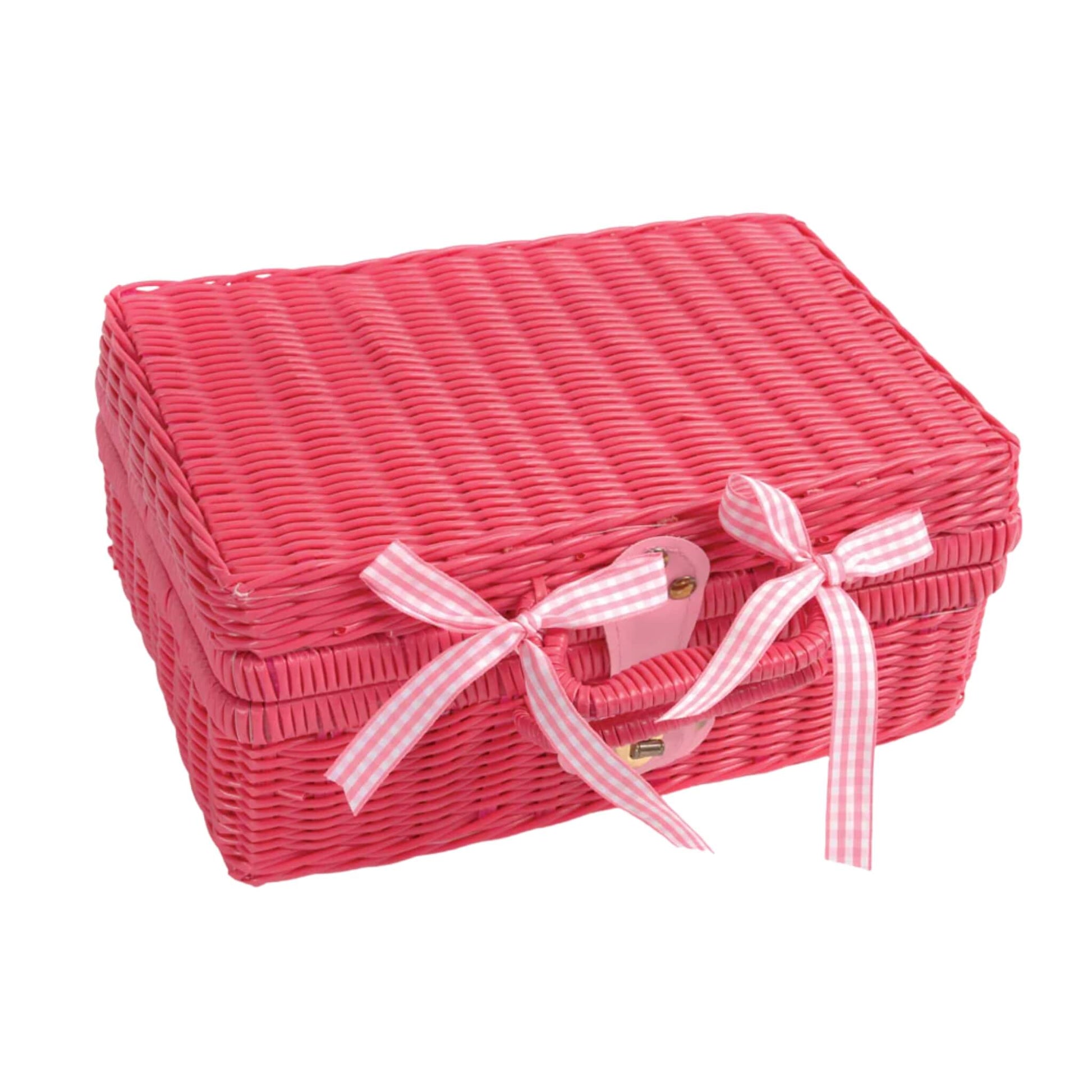 Closed pink wicker picnic case tied with gingham ribbon bows, showing the neat, portable design of the tea set when packed away.