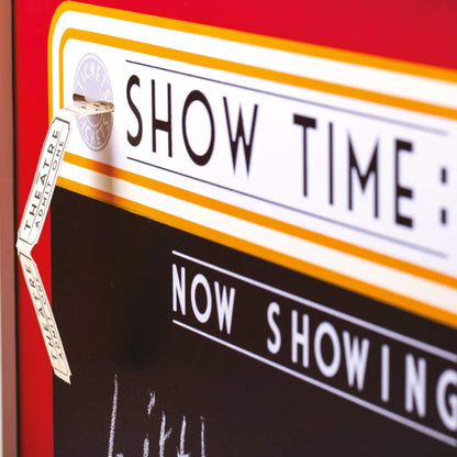 Close-up of the theatre signage with ‘Show Time: Now Showing’ printed above a chalkboard, highlighting the interchangeable display area.