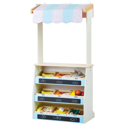 The play stand in shop mode filled with wooden food crates, featuring pricing labels and bright striped canopy in blue and white.
