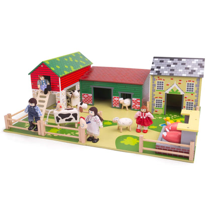 Full farmyard scene of the Tidlo Oldfield Farm playset, complete with animals, fencing, buildings and wooden farmer figures set up for imaginative play.