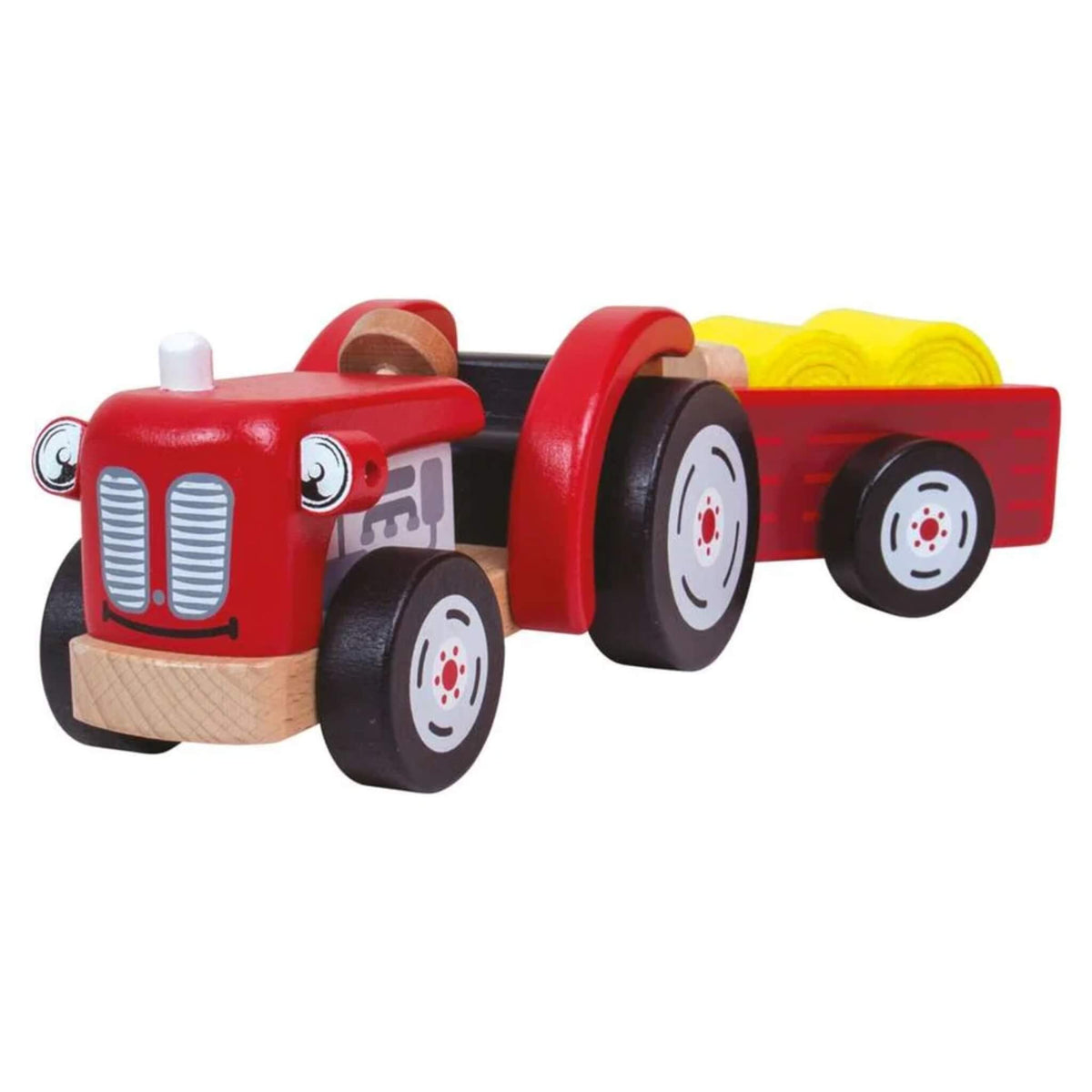 A red wooden toy tractor with chunky wheels, detachable trailer and two yellow felt hay bales.