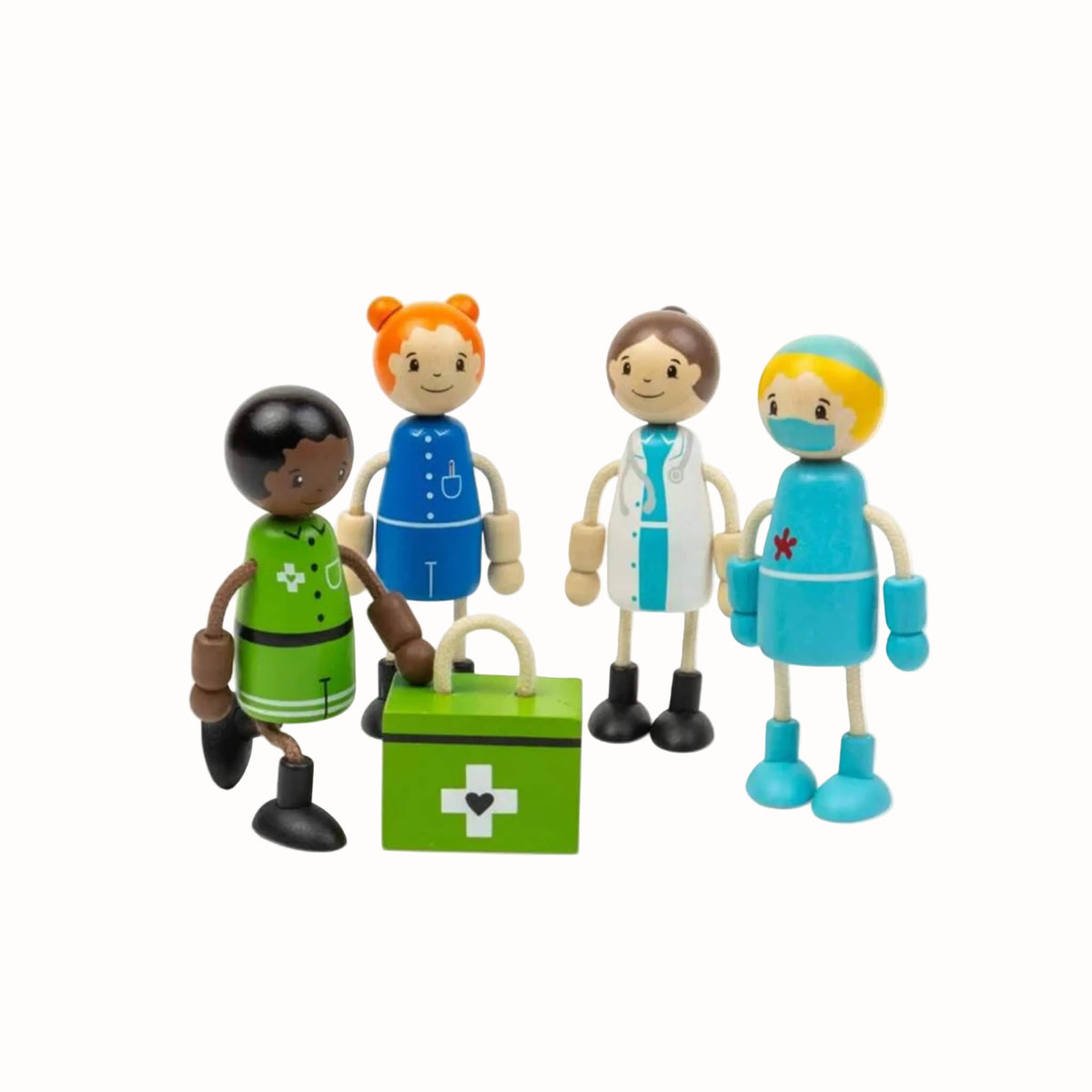 Four wooden medic dolls with flexible arms and legs, posed around a green first aid kit.