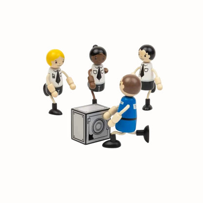 Three wooden police officers surround the prisoner as he reaches towards the toy safe.