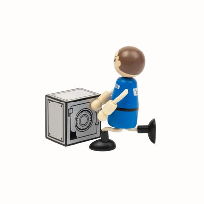 A wooden prisoner figure breaking into a grey toy safe.