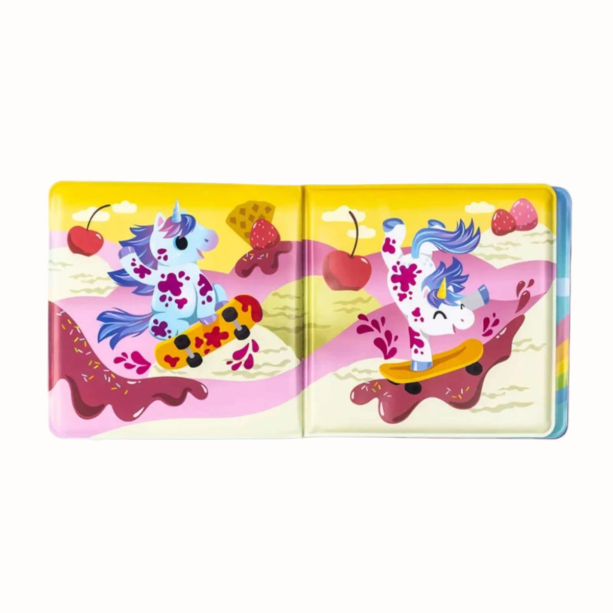 An open waterproof bath book showing unicorns skateboarding through an ice cream and strawberry scene.