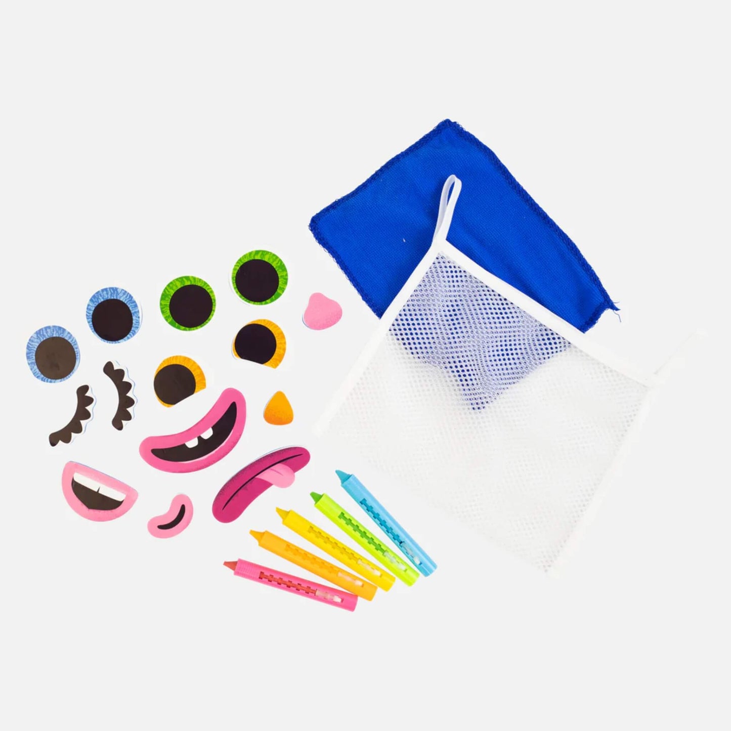 All contents of the Tiger Tribe Bath Faces laid out, including five crayons, 14 EVA foam features, blue cloth, and mesh storage pouch.
