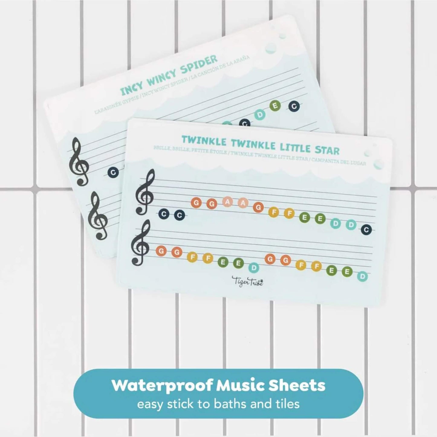 Two waterproof music sheets showing simple colour-coded melodies for songs like “Twinkle Twinkle Little Star” and “Incy Wincy Spider”.