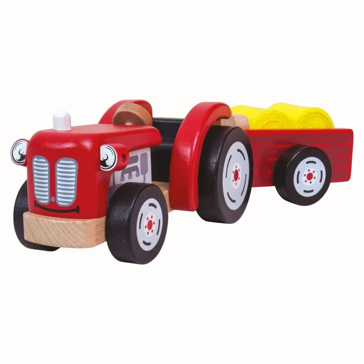 A red wooden tractor with detachable trailer and two yellow felt hay bales.