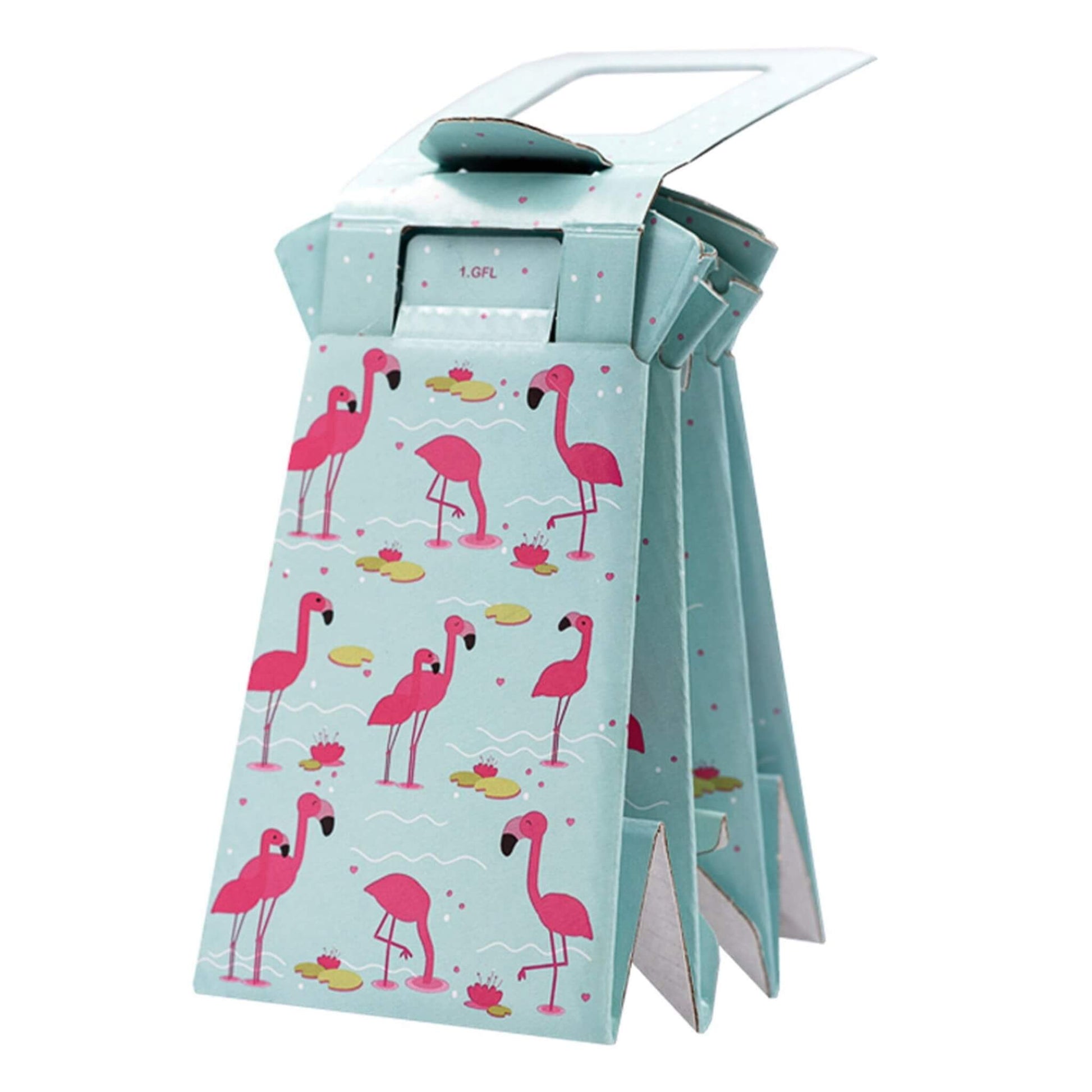 Folded portable potty in flamingo print, shown in compact carry-ready position with handle visible.