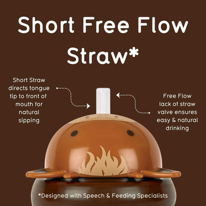 An informational product graphic for a short free flow straw. A brown cow-style sippy cup with a white straw is centred on a dark brown background, with white text and dotted arrows explaining the short straw design and free flow drinking feature.